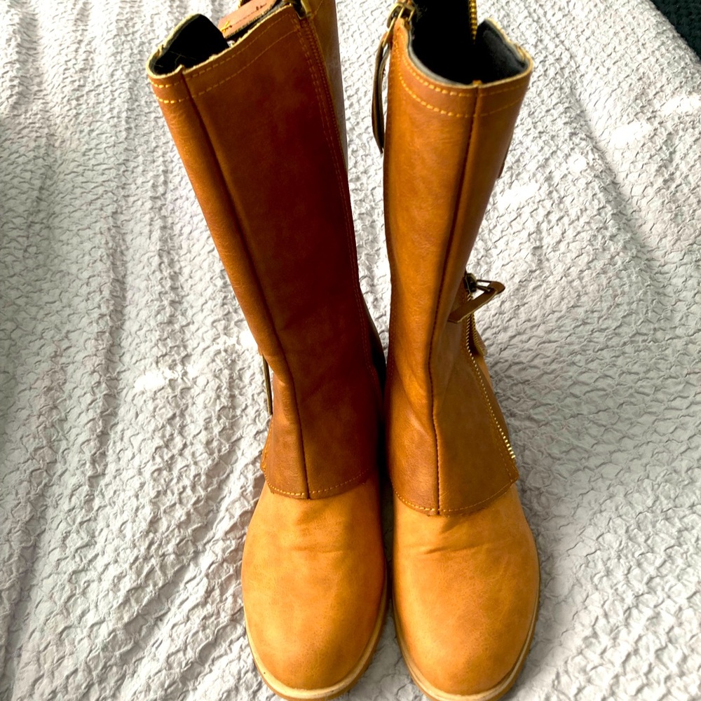 Super cute layered faux leather boots. Never worn.